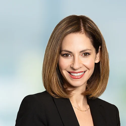A photo of attorney Melissa Daugherty against a softly blurred office background