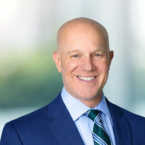 A photo of attorney, Jeff Rosin, against a softly blurred office background.